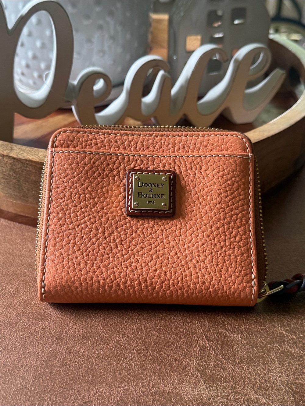 Dooney & Bourke Peach Pebbled Leather Zip Around Wallet